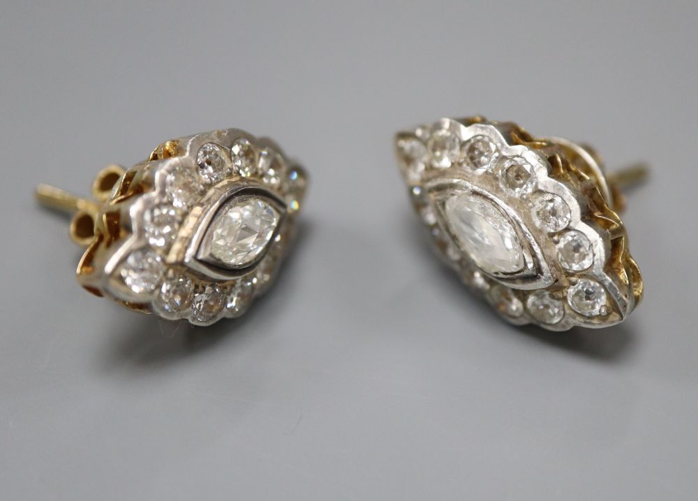 A pair of yellow metal and navette shaped diamond cluster earrings, 21mm gross 8.2 grams,